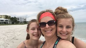 mom & two daughters on a beach vacation