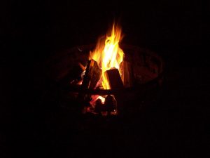 campfire at night during a minnesota family resort vacation