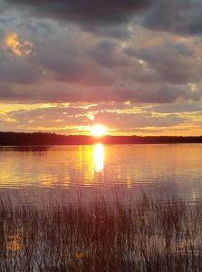 sunset over a minnesota lake resort