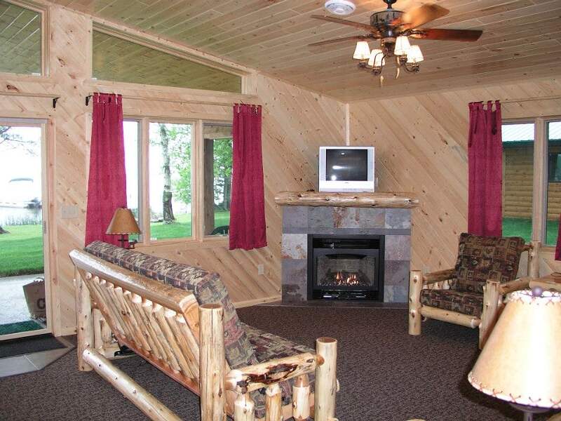 The living area has a gas fireplace and a futon that unfolds to a full bed.