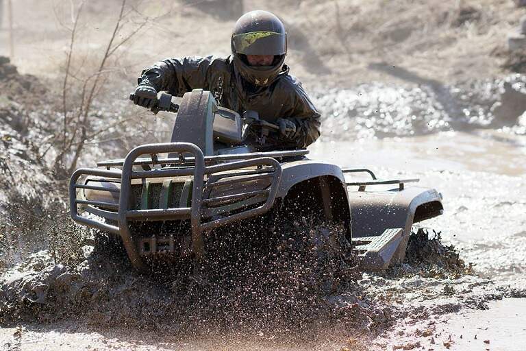 ATV driving through mud